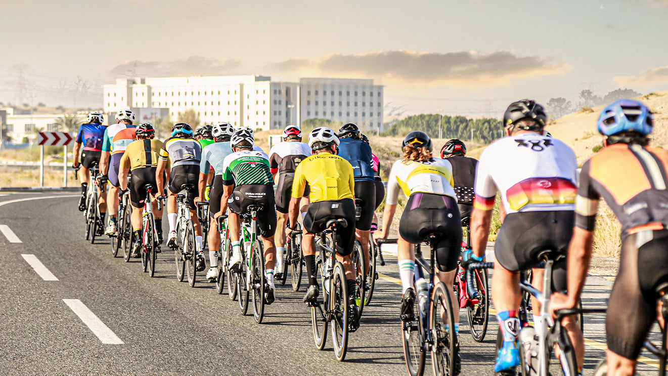 A group of cyclist riding during summer