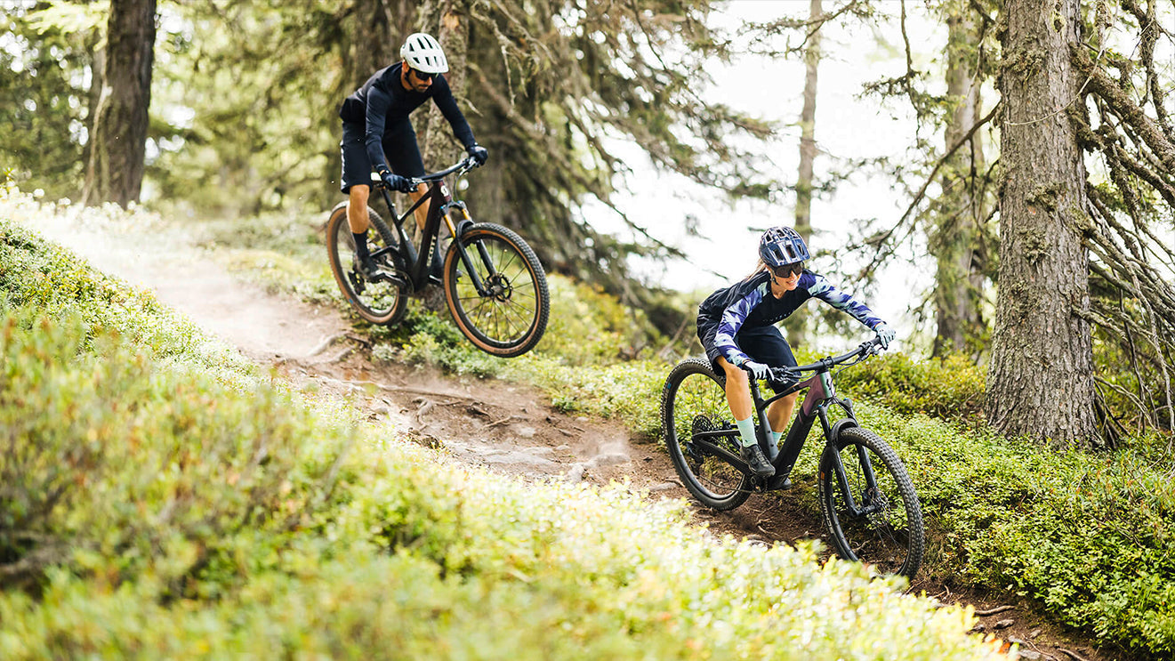 Two cyclists riding Scott Lumen ebikes