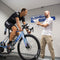 Cyclist undergoing a Geobiomized Road Bike Fitting for optimal comfort and performance on the road, ensuring a personalized and biomechanically efficient riding position.