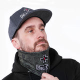 Muc-Off Neck Gaiter worn on cyclist punk green